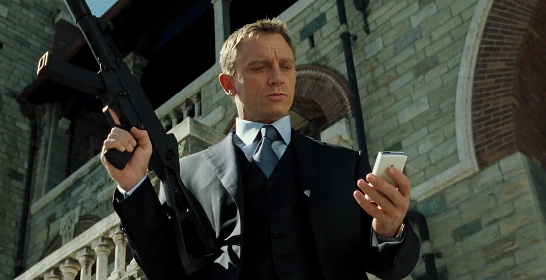 James Bond (Daniel Craig) holding a machine gun towards the end of Casino Royale