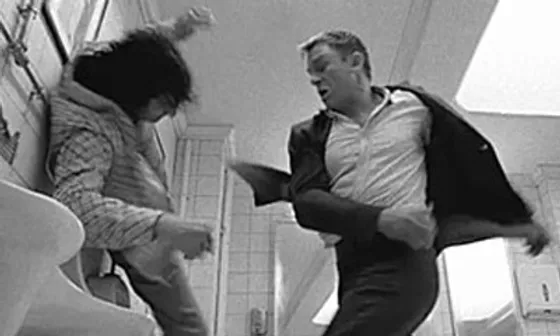 Still from Casino Royale depicting James Bond (Daniel Craig) beating up a terrorist (Darwin Shaw)